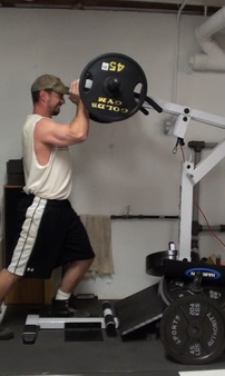 How to do the Shoulder Press on the Standing Calf Raise Machine
