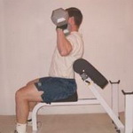 Seated Dumbbell Shoulder Press on the Preacher Bench