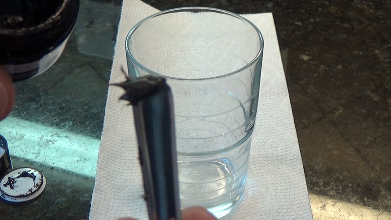 Pea-size glob of shilajit resin on spoon