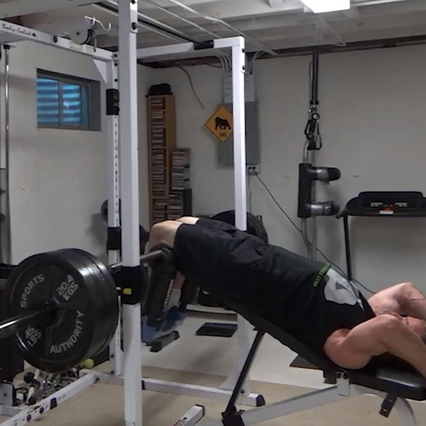 Decline Lying Leg Extensions With a Rotary Safety Squat Bar