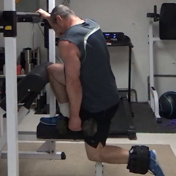 Knee Braced Single Leg Squats With Preacher Bench